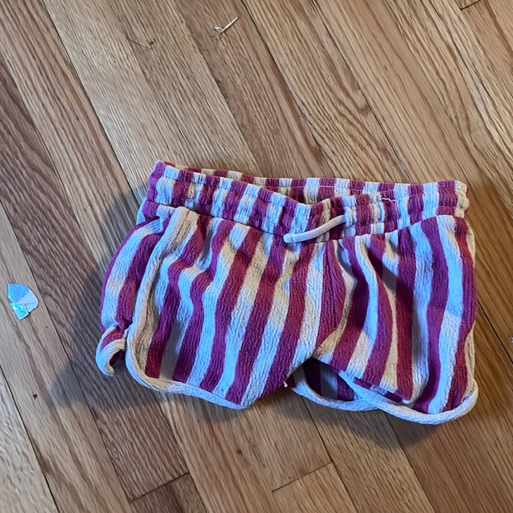 a pinkish purplish shorts with a string.